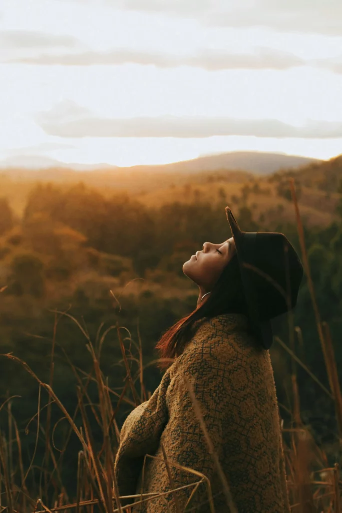 woman in the field thinking
